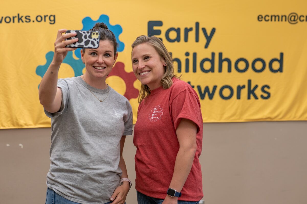 Two early childhood providers taking a photo together